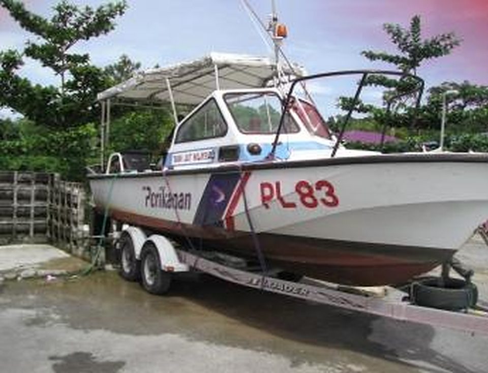 Fisheries patrol boat PL83 on a road trailer