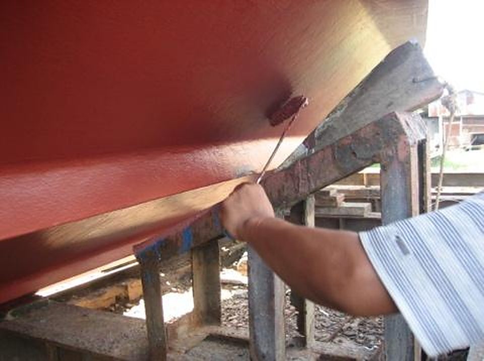 Antifouling paint being applied to a hull